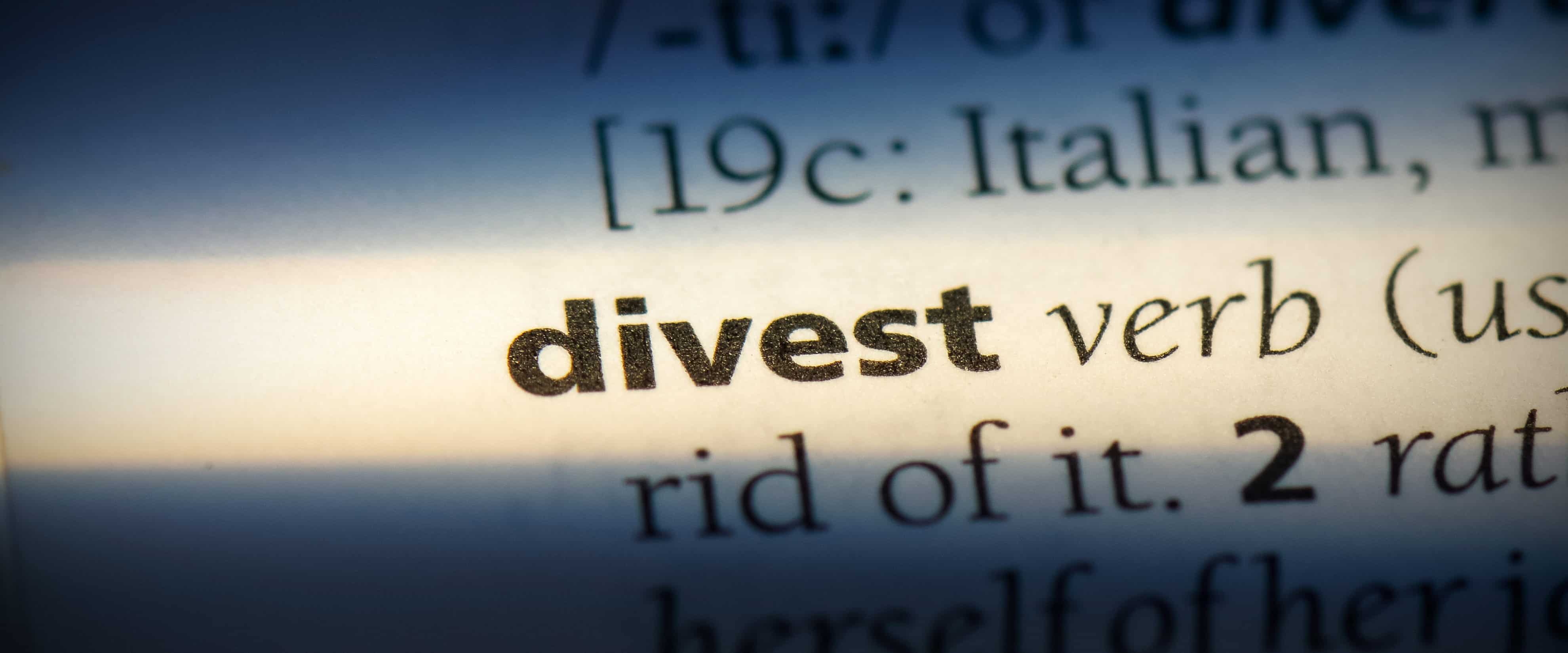 Zoomed in photo of the word divest in the dictionary.