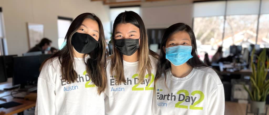 CarbonBetter marketing interns Voon, Jessica, and Mia pose for a picture while preparing for the Earth Day Austin 2022 event.