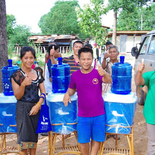An image showing locals getting clean water from TerraClear.