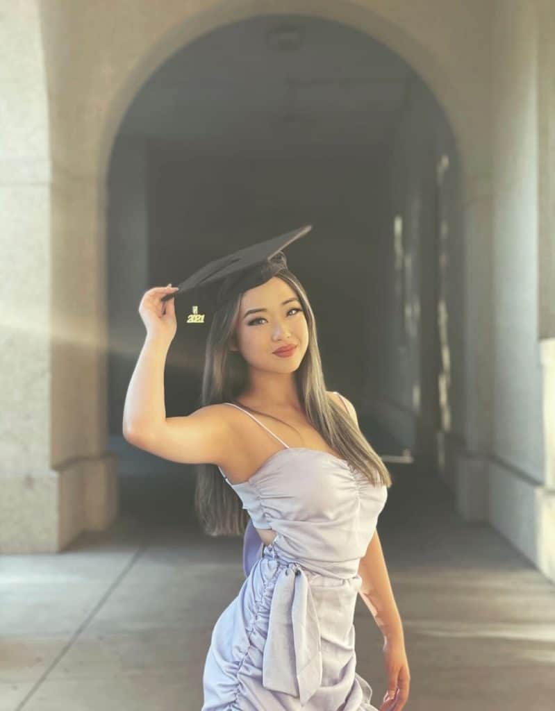 Cloie posing after graduation.