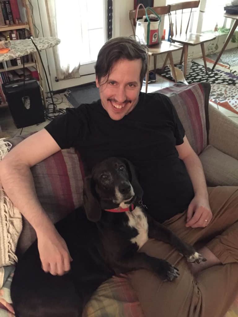 Scott Butler with his dog, Michigan (Michi).