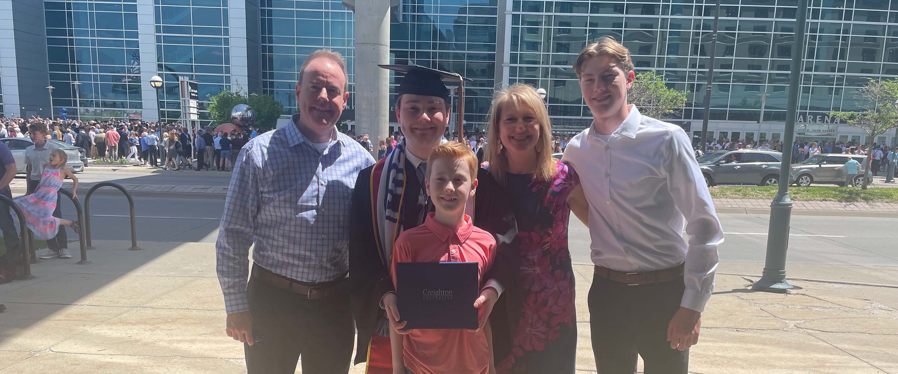 Ethan Hill, Credit and Risk Analyst at CarbonBetter. Shown with his family.