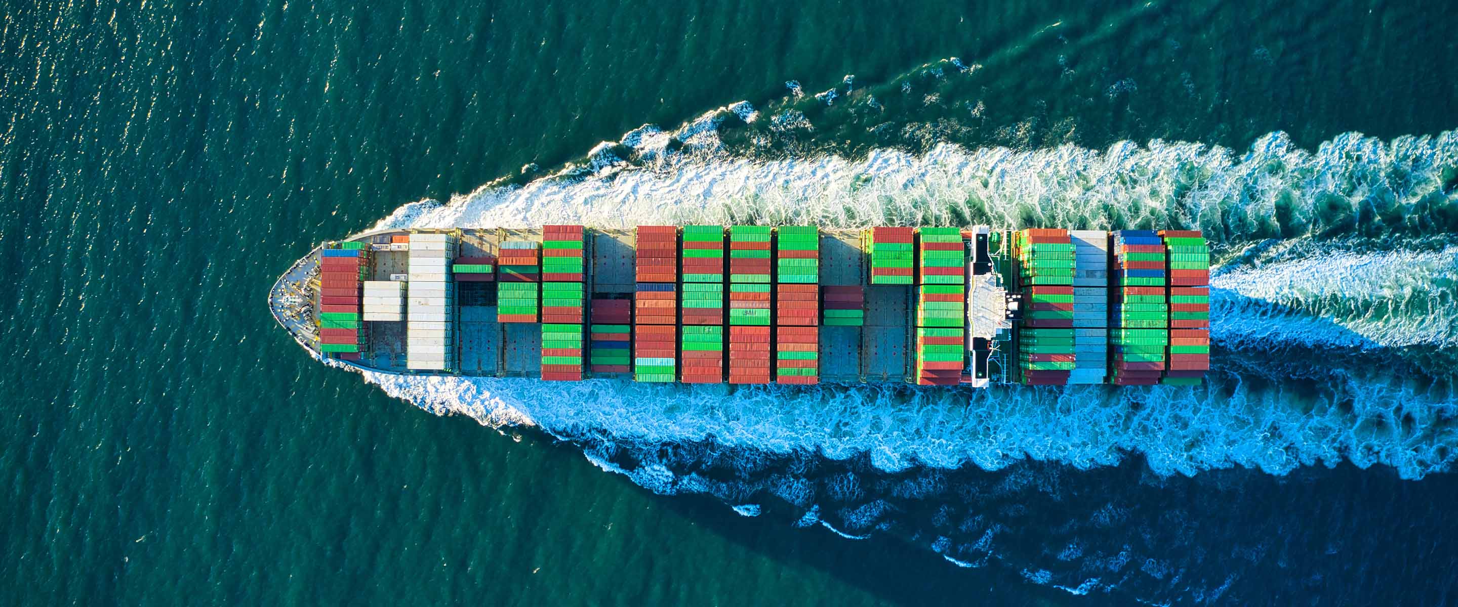 Overhead view of a cargo ship at sea.