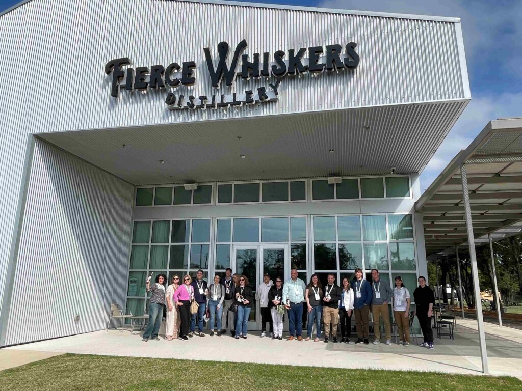 A tour group outside of Fierce Whiskers Distillery during SPC Impact 2023.